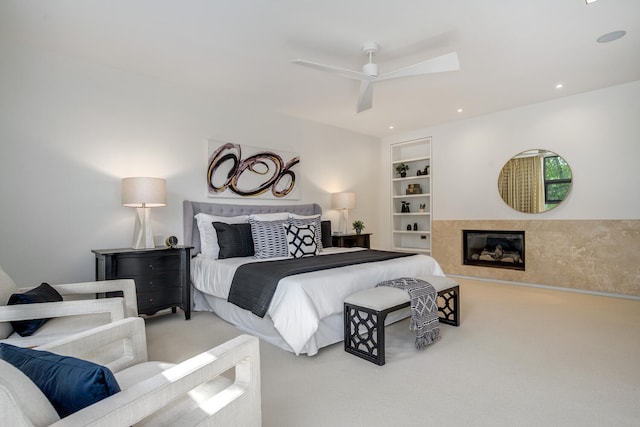 bedroom with ceiling fan and light carpet