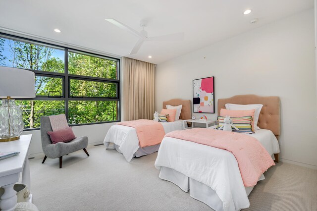 carpeted bedroom featuring ceiling fan