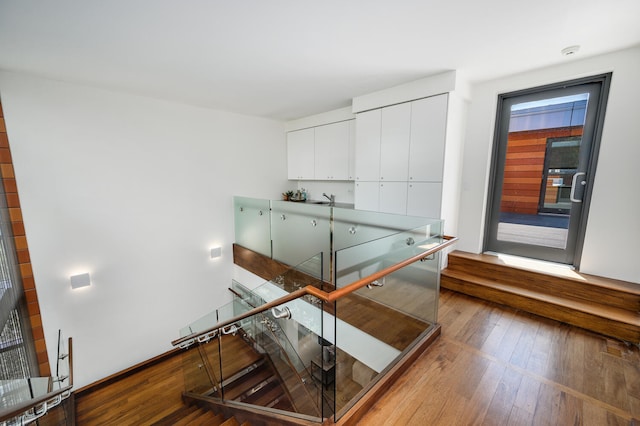 interior space featuring a wealth of natural light and hardwood / wood-style floors