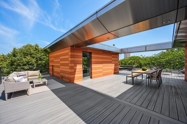 wooden deck featuring an outdoor living space