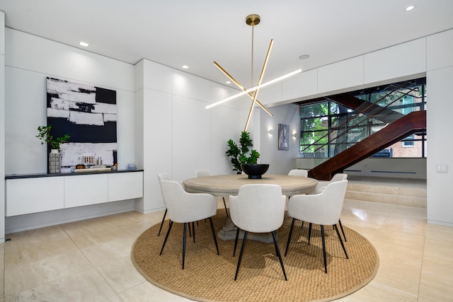 tiled dining room with a notable chandelier