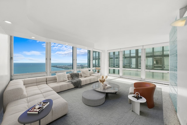 sunroom / solarium featuring a water view