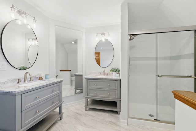 3944 Paradise Canyon Ct, Naperville, IL 60564 - bathroom with two vanities, a shower stall, a sink, and marble finish floor