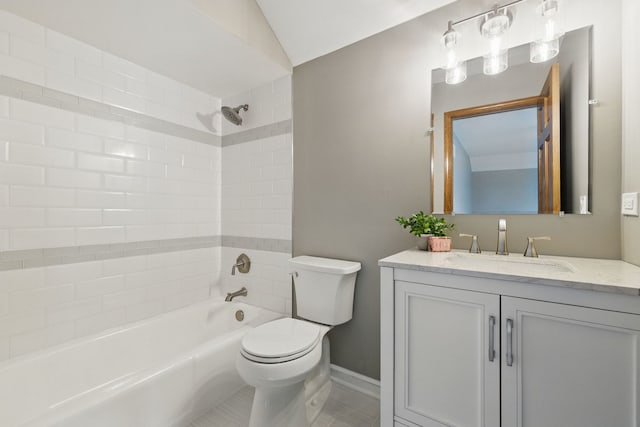 full bathroom featuring vanity, toilet, shower / bath combination, baseboards, and lofted ceiling