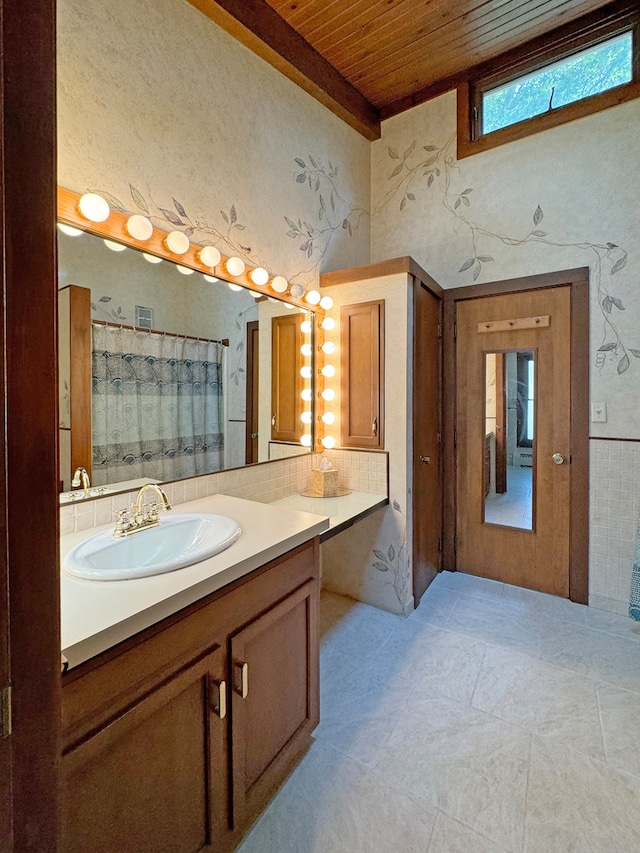 bathroom featuring wooden ceiling, a shower with curtain, beam ceiling, and vanity