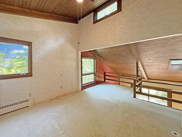 bonus room with wood ceiling, high vaulted ceiling, plenty of natural light, and a baseboard radiator