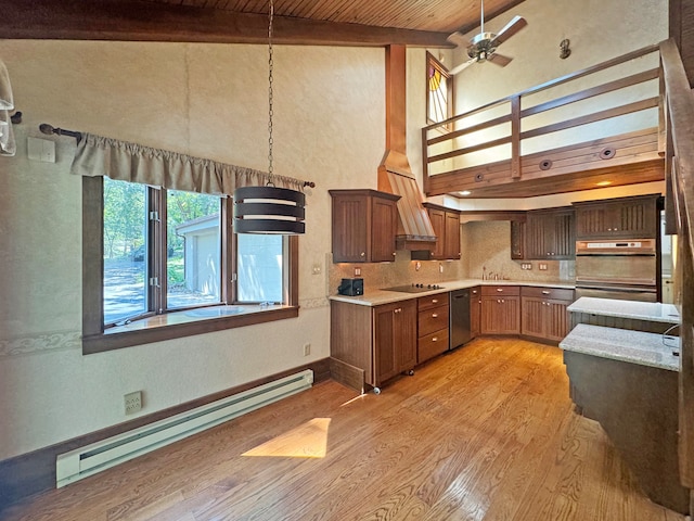 kitchen with dishwasher, baseboard heating, decorative backsplash, ceiling fan, and light hardwood / wood-style floors