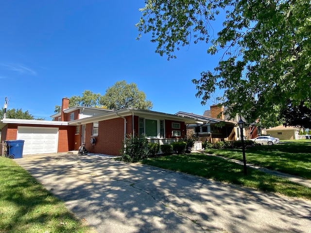 single story home featuring a garage and a front lawn