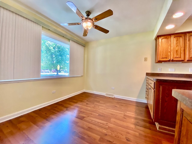 interior space featuring ceiling fan and light hardwood / wood-style floors