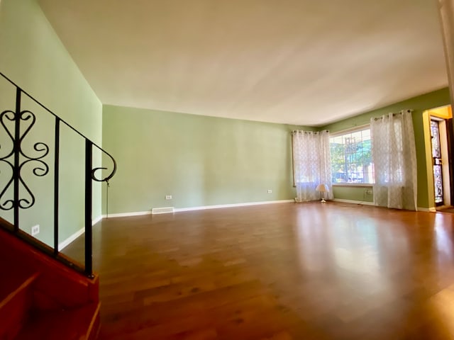 empty room with hardwood / wood-style floors