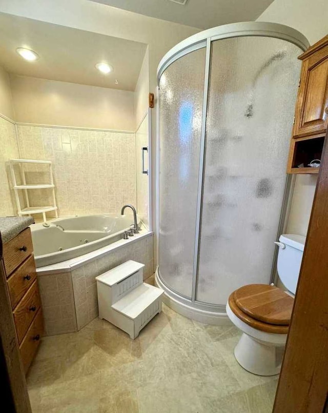 bathroom featuring separate shower and tub, toilet, and tile patterned floors