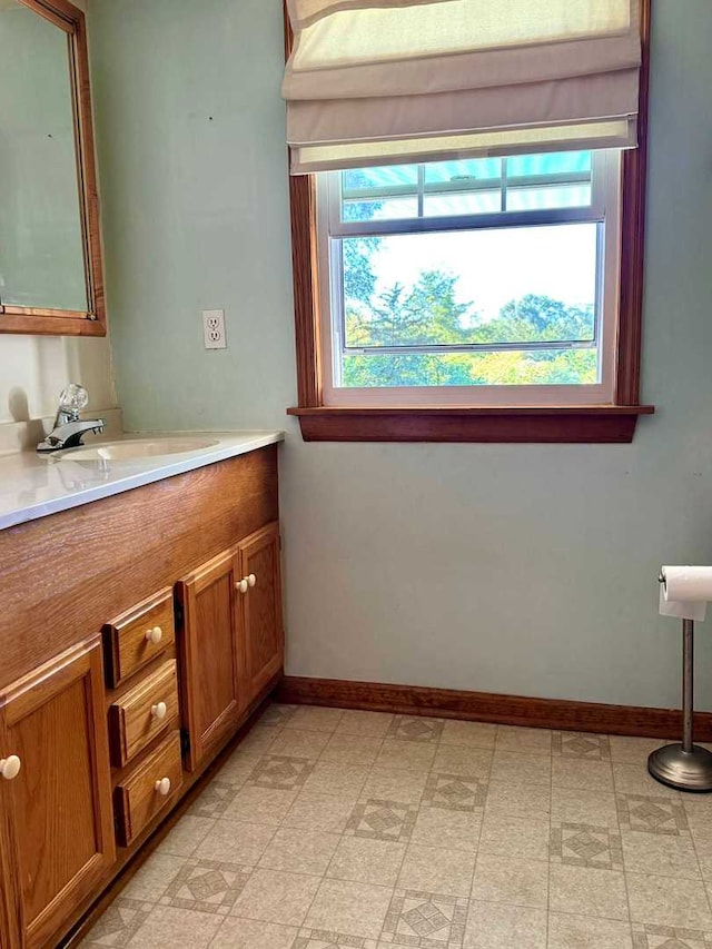 bathroom with vanity and a healthy amount of sunlight