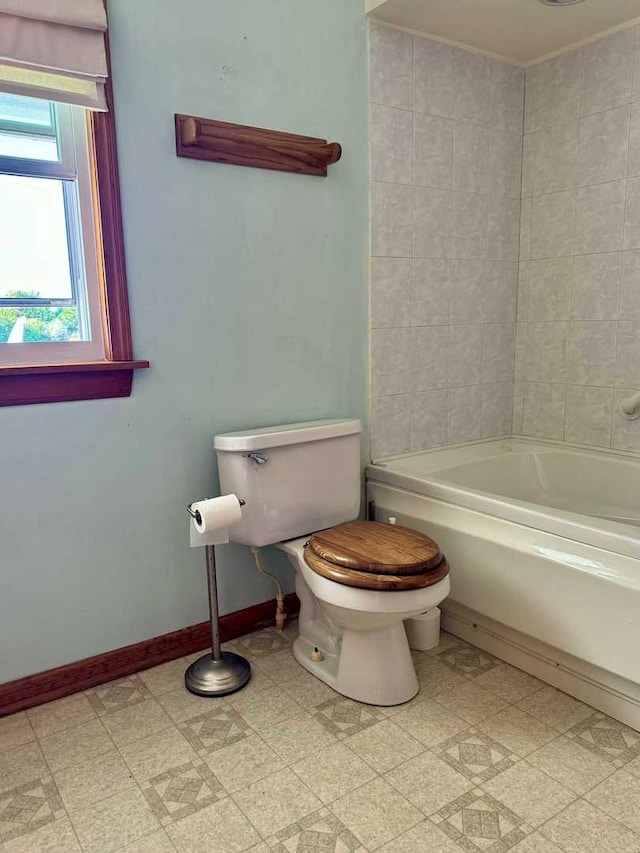 bathroom with shower / bath combination and toilet