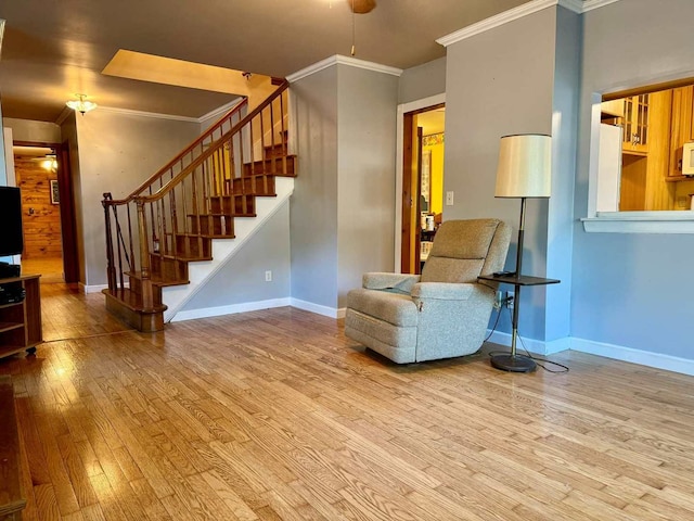 unfurnished room featuring ornamental molding and light hardwood / wood-style floors