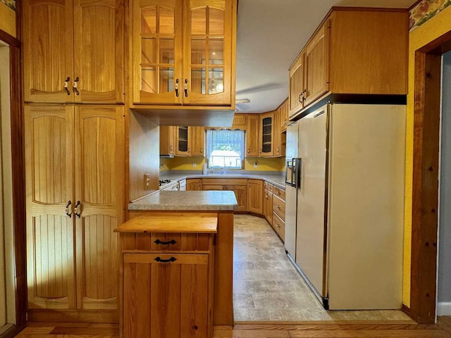 kitchen with white appliances and kitchen peninsula