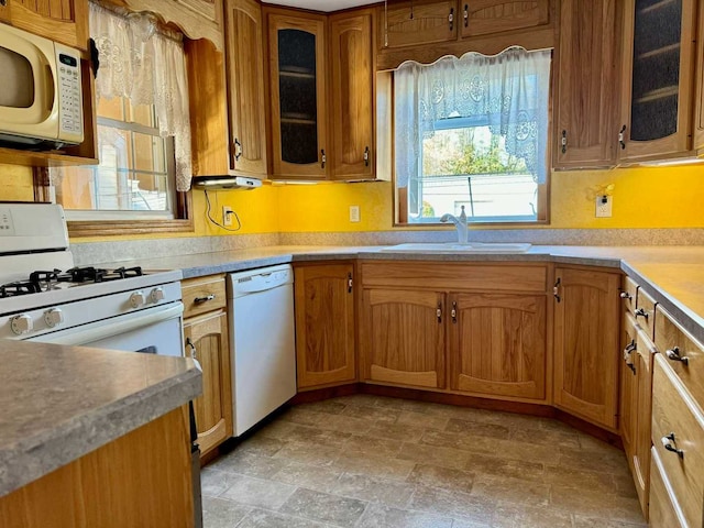 kitchen with sink and white appliances