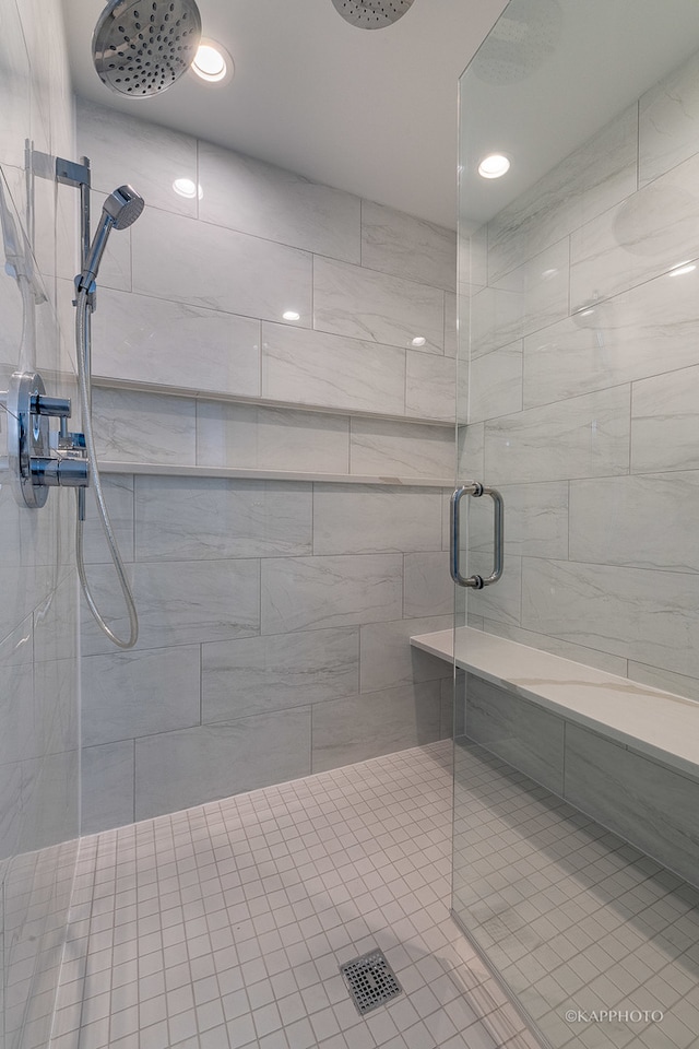 bathroom featuring a shower with door