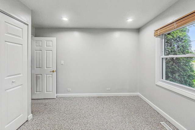 spare room with light colored carpet