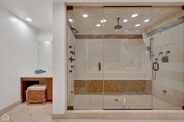 bathroom with tile patterned flooring and a shower with door