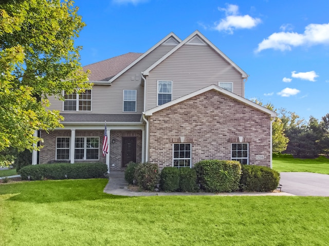 view of property with a front lawn