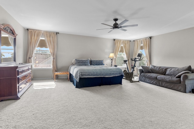 bedroom with ceiling fan and carpet