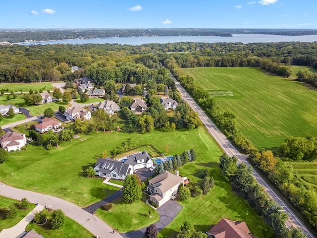 drone / aerial view featuring a rural view and a water view