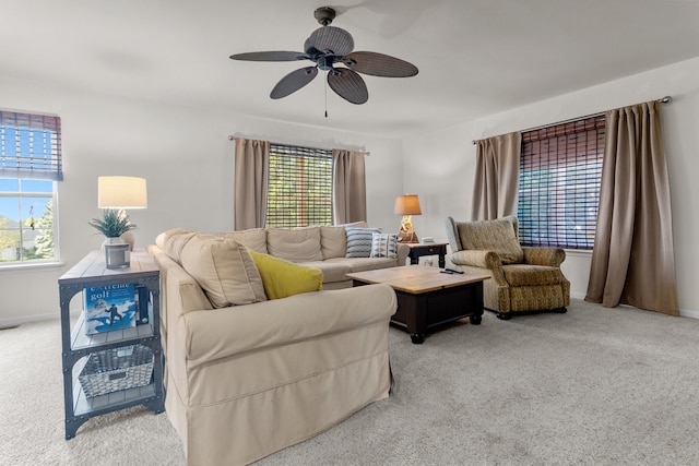 carpeted living room featuring ceiling fan