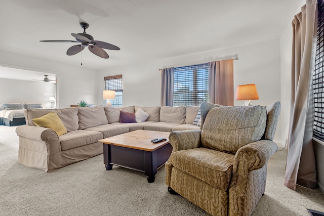 carpeted living room with a healthy amount of sunlight