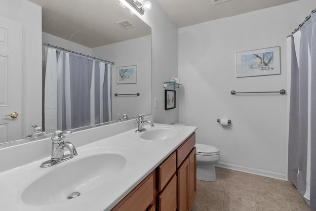 bathroom featuring tile patterned floors, toilet, a shower with shower curtain, and vanity