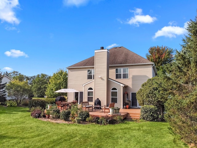 back of house featuring a patio and a lawn