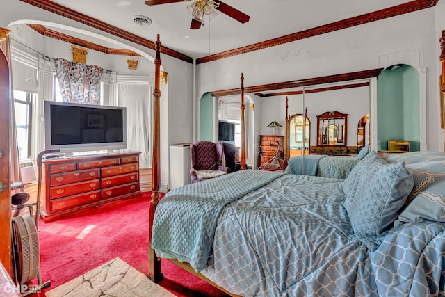 carpeted bedroom with ceiling fan and ornamental molding