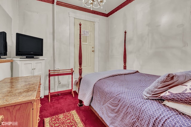 carpeted bedroom featuring ornamental molding and a chandelier