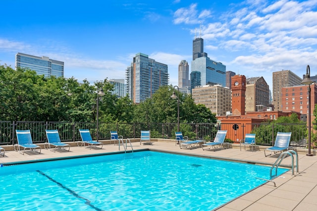 view of swimming pool with a patio