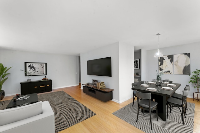 dining space with light hardwood / wood-style floors