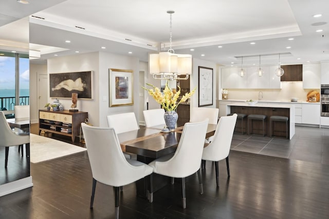 1040 N Lake Shore Dr Unit 9A, Chicago, IL 60611 - dining space featuring dark wood-style floors, recessed lighting, and a raised ceiling