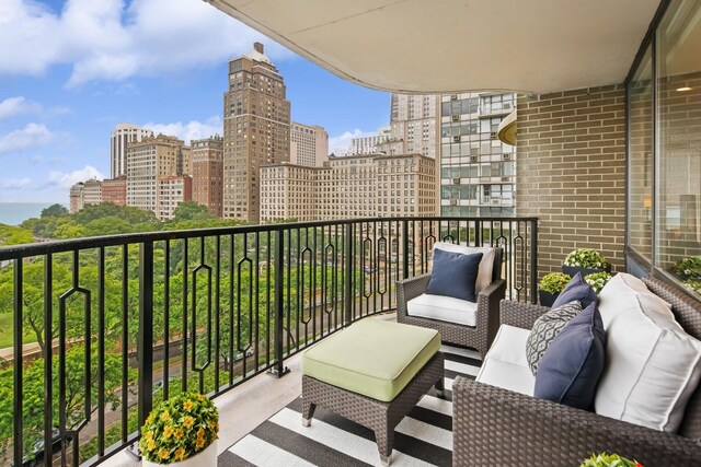 1040 N Lake Shore Dr Unit 9A, Chicago, IL 60611 - balcony with an outdoor living space and a city view