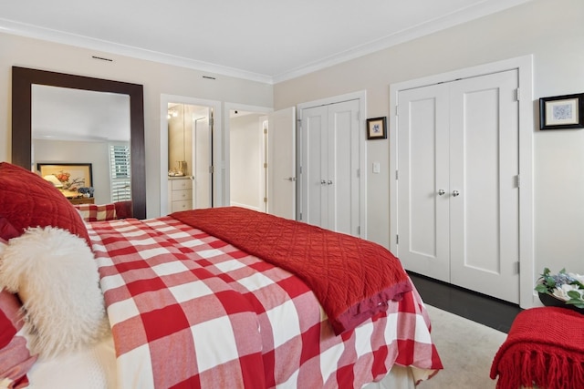 1040 N Lake Shore Dr Unit 9A, Chicago, IL 60611 - bedroom featuring multiple closets, ornamental molding, wood finished floors, and ensuite bathroom