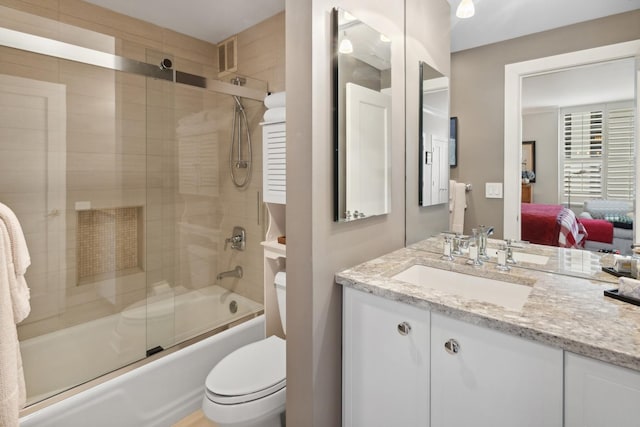 1040 N Lake Shore Dr Unit 9A, Chicago, IL 60611 - bathroom with connected bathroom, shower / bath combination with glass door, vanity, and toilet