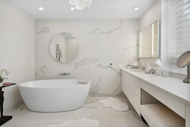 1040 N Lake Shore Dr Unit 9A, Chicago, IL 60611 - bathroom featuring marble tiled flooring, a soaking tub, vanity, and recessed lighting