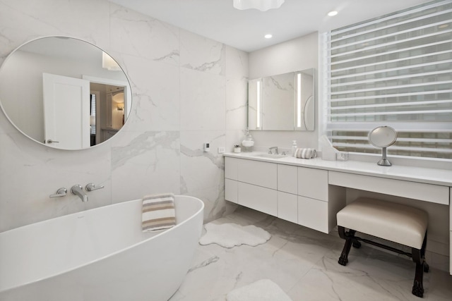 1040 N Lake Shore Dr Unit 9A, Chicago, IL 60611 - bathroom with a freestanding bath, marble tiled floors, vanity, and recessed lighting