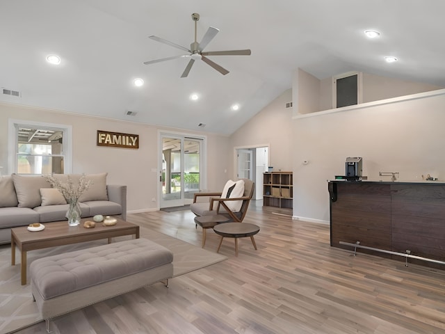 living room with high vaulted ceiling, hardwood / wood-style flooring, and ceiling fan