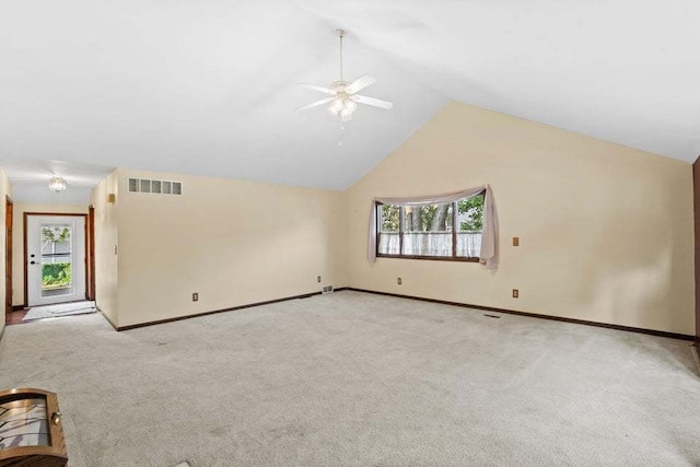 bonus room with a healthy amount of sunlight, ceiling fan, and light carpet