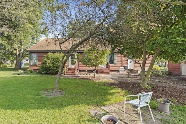 back of house featuring a lawn