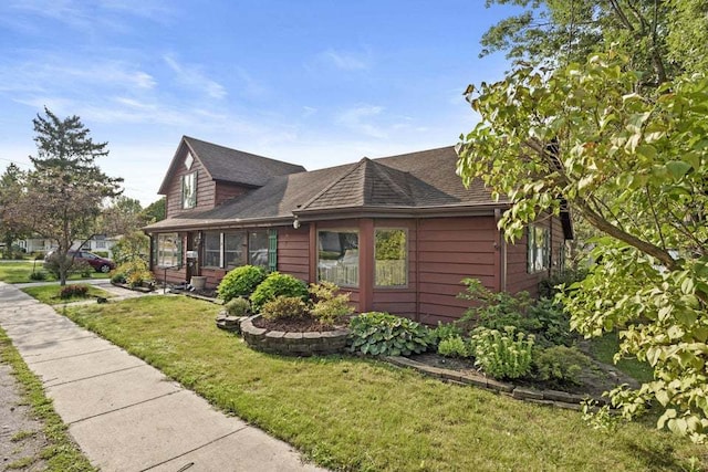 view of property exterior with a lawn