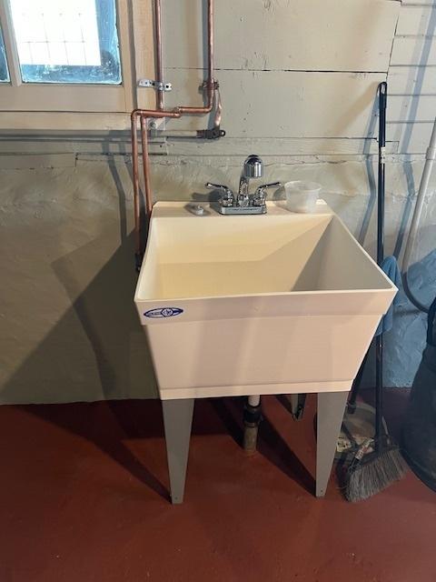 utility room featuring a sink