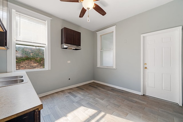 interior space featuring light wood-type flooring and ceiling fan