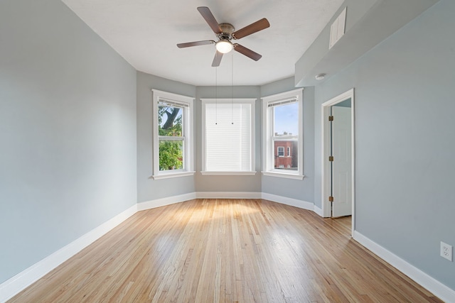 spare room with ceiling fan and light hardwood / wood-style floors