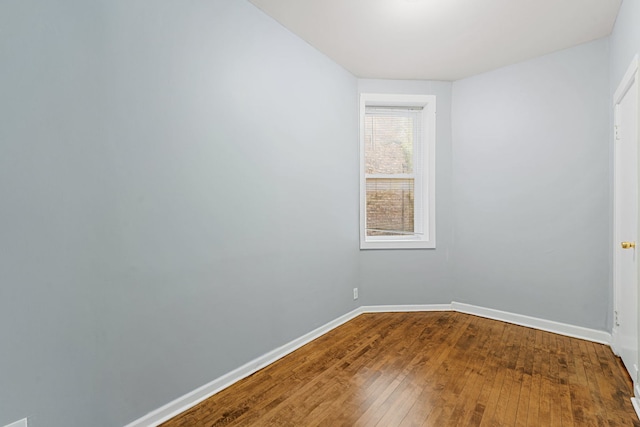 spare room with hardwood / wood-style floors