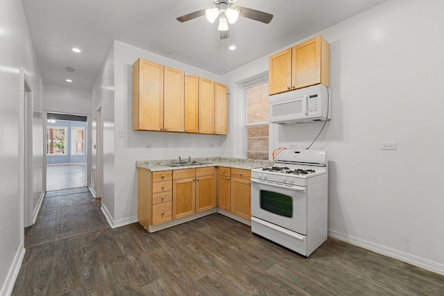 kitchen featuring white appliances, dark hardwood / wood-style floors, light brown cabinetry, and ceiling fan