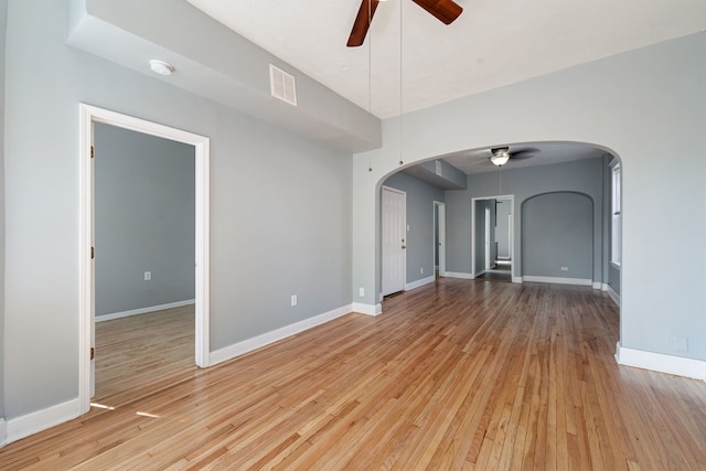 unfurnished room featuring light wood-type flooring and ceiling fan